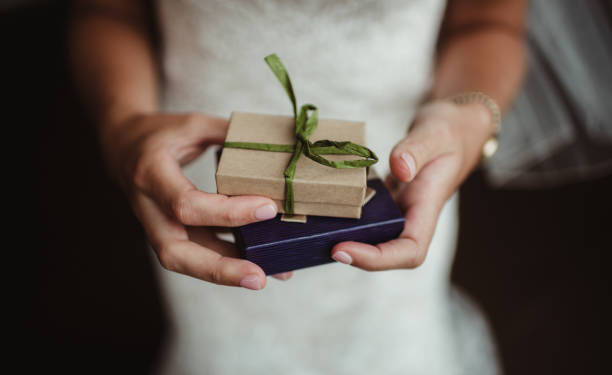 Woman holding wrapped presents in her hands